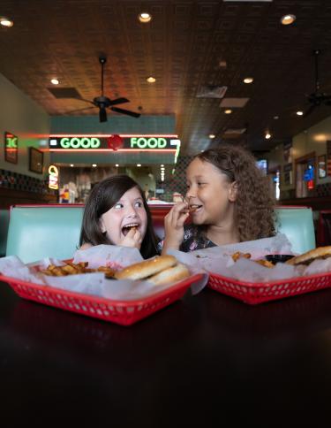 kids enjoying burgers at dyers