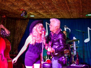 Dale and Celine Watson of Hernandos Hideaway singing together on stage