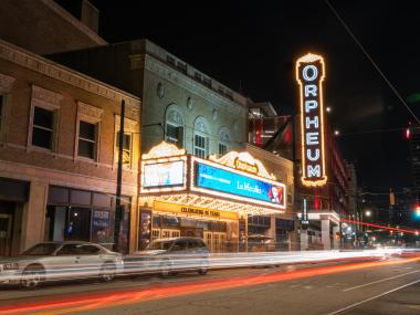 Timelapse outside of Orpheum Theatre at night.