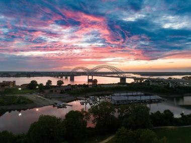 Hernando De Soto Bridge at sunset over the Mississippi River in Memphis, TN