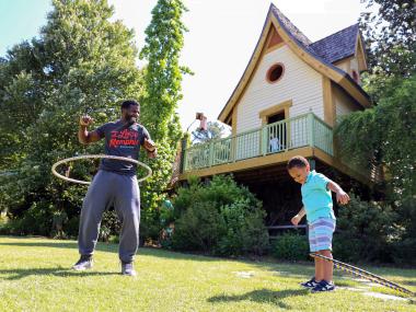 A family playing in My Big Backyard at Memphis Botanic Garden