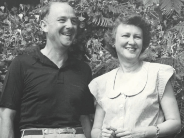 man and woman side by side smiling, black and white photo
