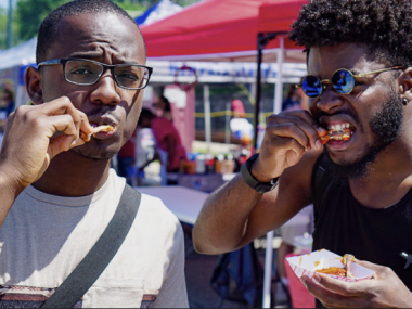 two men eating hot wings
