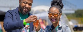 couple cheers glasses if mimosas