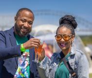couple cheers glasses if mimosas
