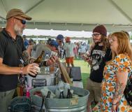 brewery rep pours samples for Brewfest patrons