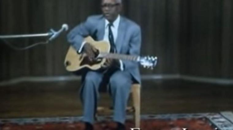 A still image from a video of Memphis blues legend Furry Lewis performing "Furry's Blues"