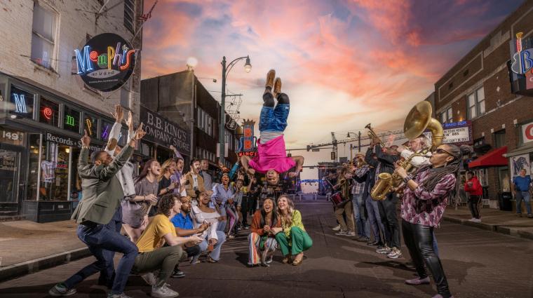 people lined up on beale street with beale street flippers jumping over their heads