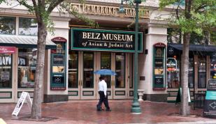 Tourists walk past the Belz Museum of Asian and Judaic art on Main Street in downtown Memphis Photo