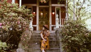 Woman in front of Mollie Fontaine Lounge Photo