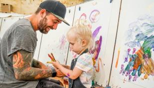 Family enjoying "art free play" at The Art Project in Overton Square Photo