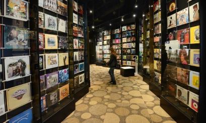 hallway with walls covered in record sleeves at the Stax Museum