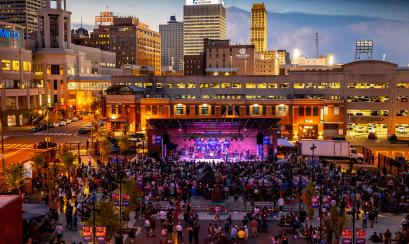 view of stage at Handy Park during outdoor live concert and downtown Memphis skyline