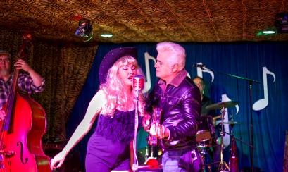 Dale and Celine Watson of Hernandos Hideaway singing together on stage