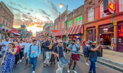 Conference and band marching on Beale Street