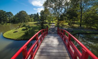 Memphis Botanic Garden bridge over water with red siding