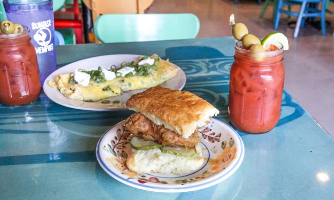 A biscuit, omelet and Bloody Mary on a table at Sunrise Memphis.