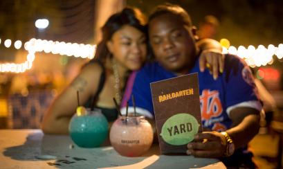couple looks at menu at Railgarten
