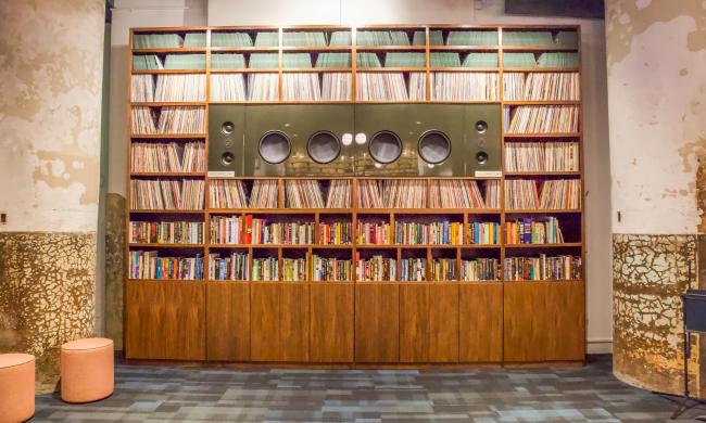 Memphis Listening Lab wall of albums and music books