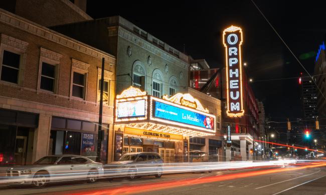 Timelapse outside of Orpheum Theatre at night.