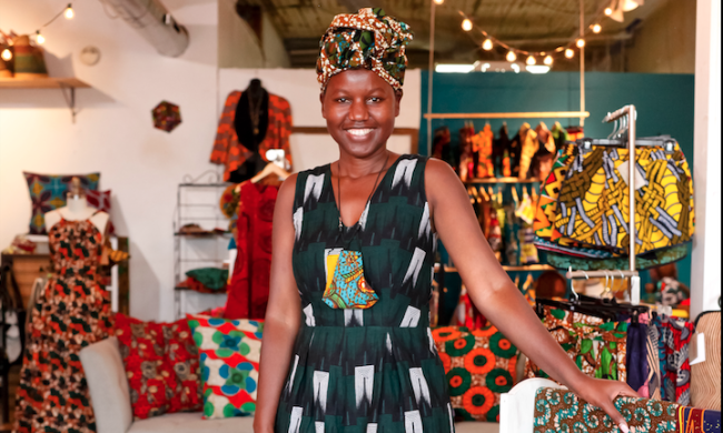 Owner of House of Style poses in store for photo.