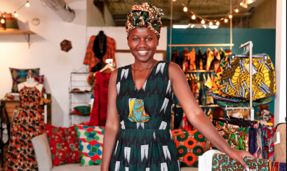 owner of house of style poses in store for photo