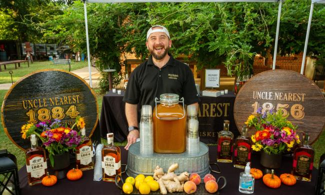 A Uncle Nearest 1884 bourbon booth at the Memphis Bacon &amp; Bourbon Festival.