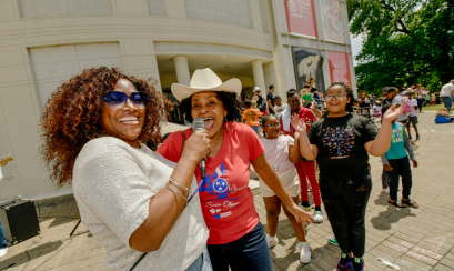 A group outside the museum enjoying an event at the Memphis Brooks Museum of Art.