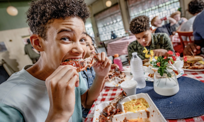 teen eating ribs from Paynes