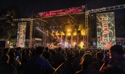 The stage with a crowd of people watching at Mempho Music Festival.
