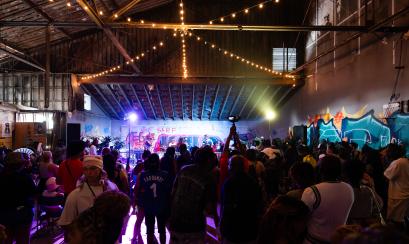 people gathered around stage during music performance