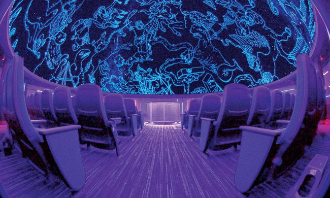 The AutoZone Dome Planetarium illuminated at the Pink Palace Museum &amp; Mansion