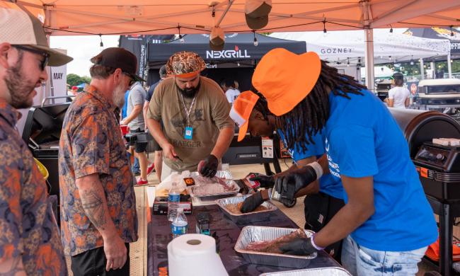 A cooking team preparing barbecue at World Championship Barbecue Cooking Contest.