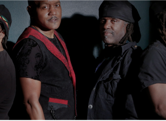 Victor Wooten alongside his brothers