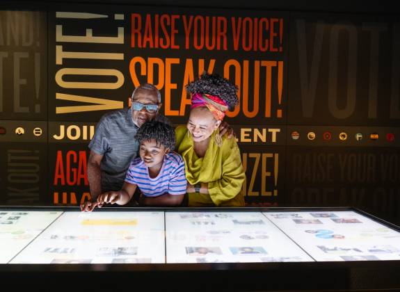 A family explores an interactive exhibit at Memphis' National Civil Rights Museum