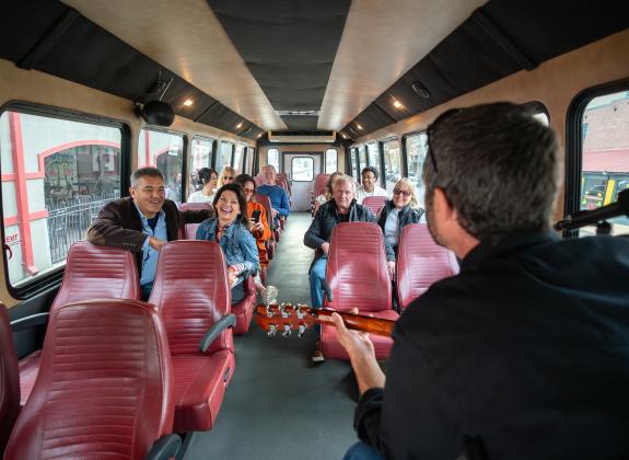 couple on tour bus enjoying backbeat tours