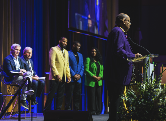 honoree stands on stage giving speech