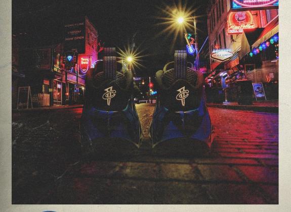 PIcutre of two Shoes on the street with the words "ballin on Beale" acorss the bottom