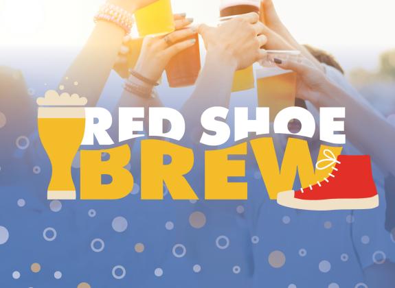 Red Shoe Brew in white and yellow letter with a yellow cartoon of a bubble beer and a red shoe converse cartoon