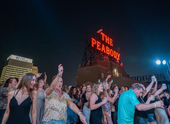 people dancing during Peabody rooftop party