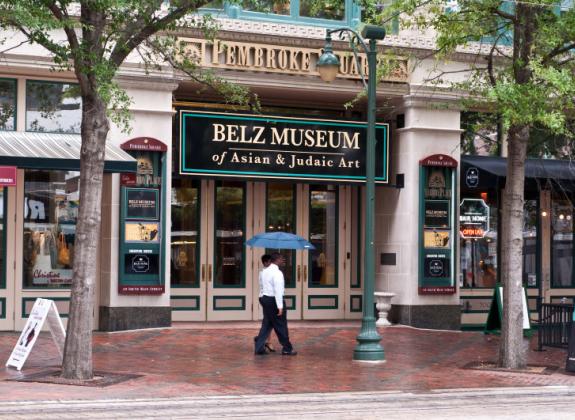 Tourists walk past the Belz Museum of Asian and Judaic art on Main Street in downtown Memphis Photo