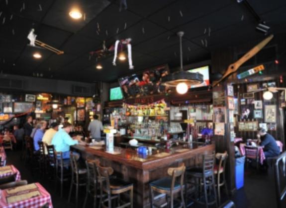 Saddle up to the bar at Huey's. Photo by Andrea Zucker. Photo 3