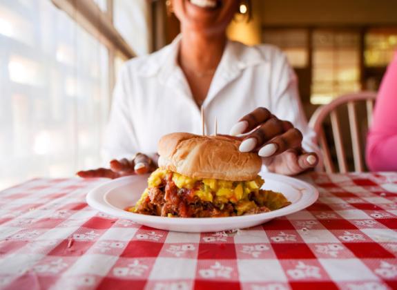 Enjoying a chopped pork barbecue sandwich from Payne's Bar-B-Que Photo