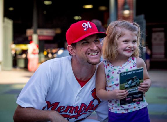 Redbirds player with fan. Photo by Craig Thompson Photo