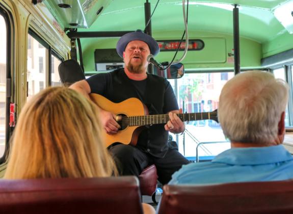 Backbeat Tour Guide playing guitar Photo 5