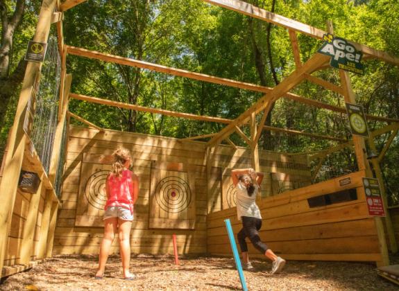 Kid's trying the outdoor Axe Throwing with Go Ape at Shelby Farms Park. Outdoor Axe Throwing with Go Ape - Kristin Luna Photo 6