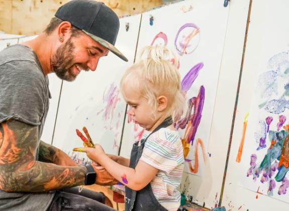 Family enjoying "art free play" at The Art Project in Overton Square Photo