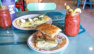 A biscuit, omelet and Bloody Mary on a table at Sunrise Memphis.