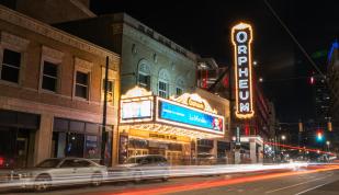 Timelapse outside of Orpheum Theatre at night.
