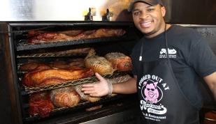 Pitmaster in front of the pit at Marlowe's Ribs &amp; Restaurant.